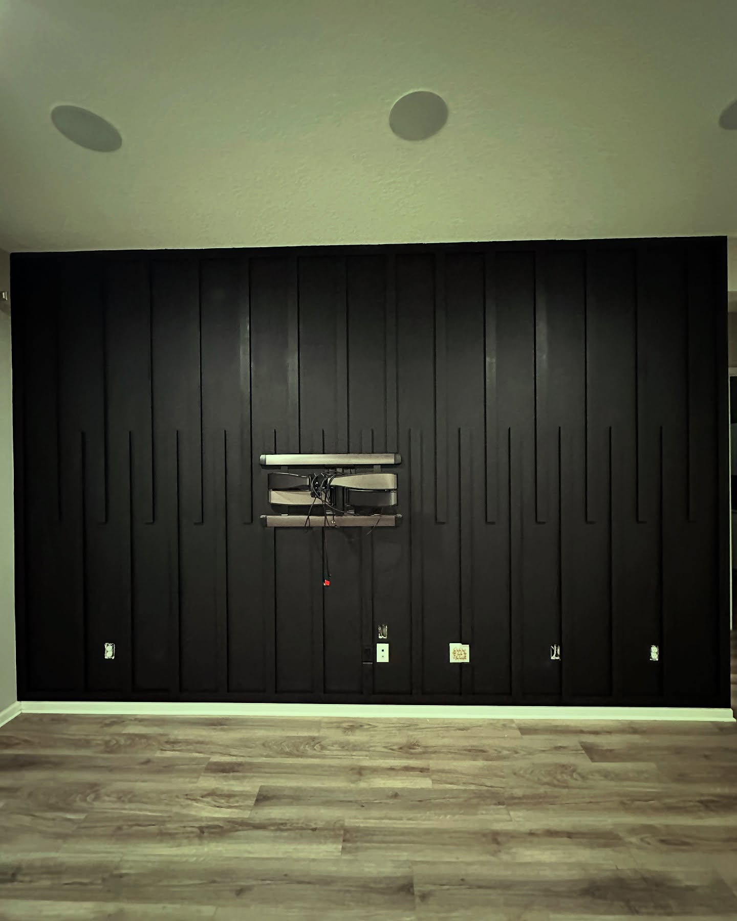 Floor-to-ceiling media wall with custom millwork by AVP Construction JAX — Jacksonville & St. John's County, FL