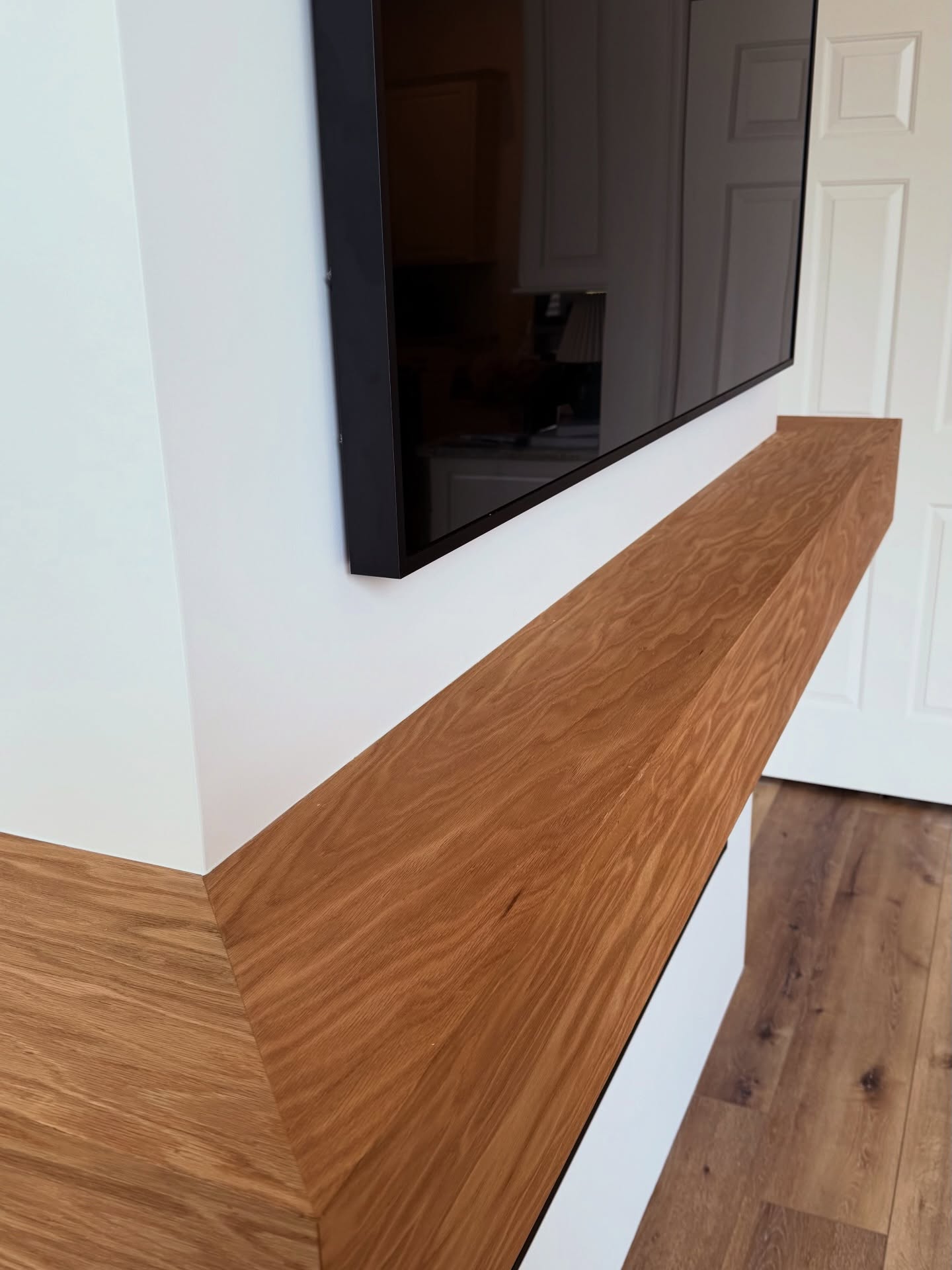 Custom living-room media wall with paneling by AVP Construction JAX — Jacksonville & St. John's County, FL