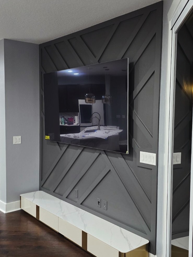Slat-wall TV feature with hidden wiring by AVP Construction JAX — Jacksonville & St. John's County, FL