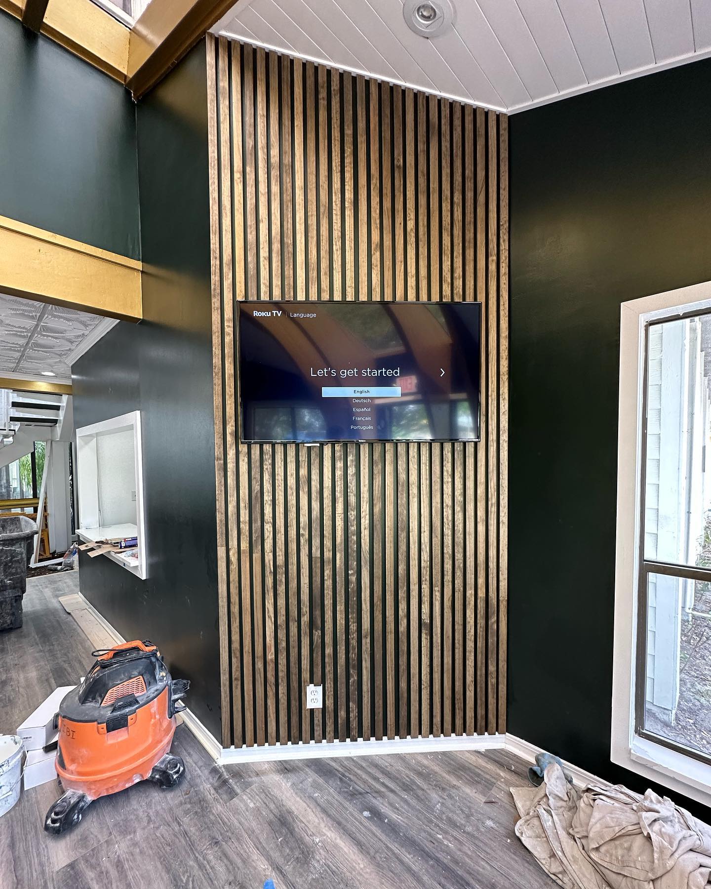 Built-in TV cabinet flanked by display shelving by AVP Construction JAX — Jacksonville & St. John's County, FL