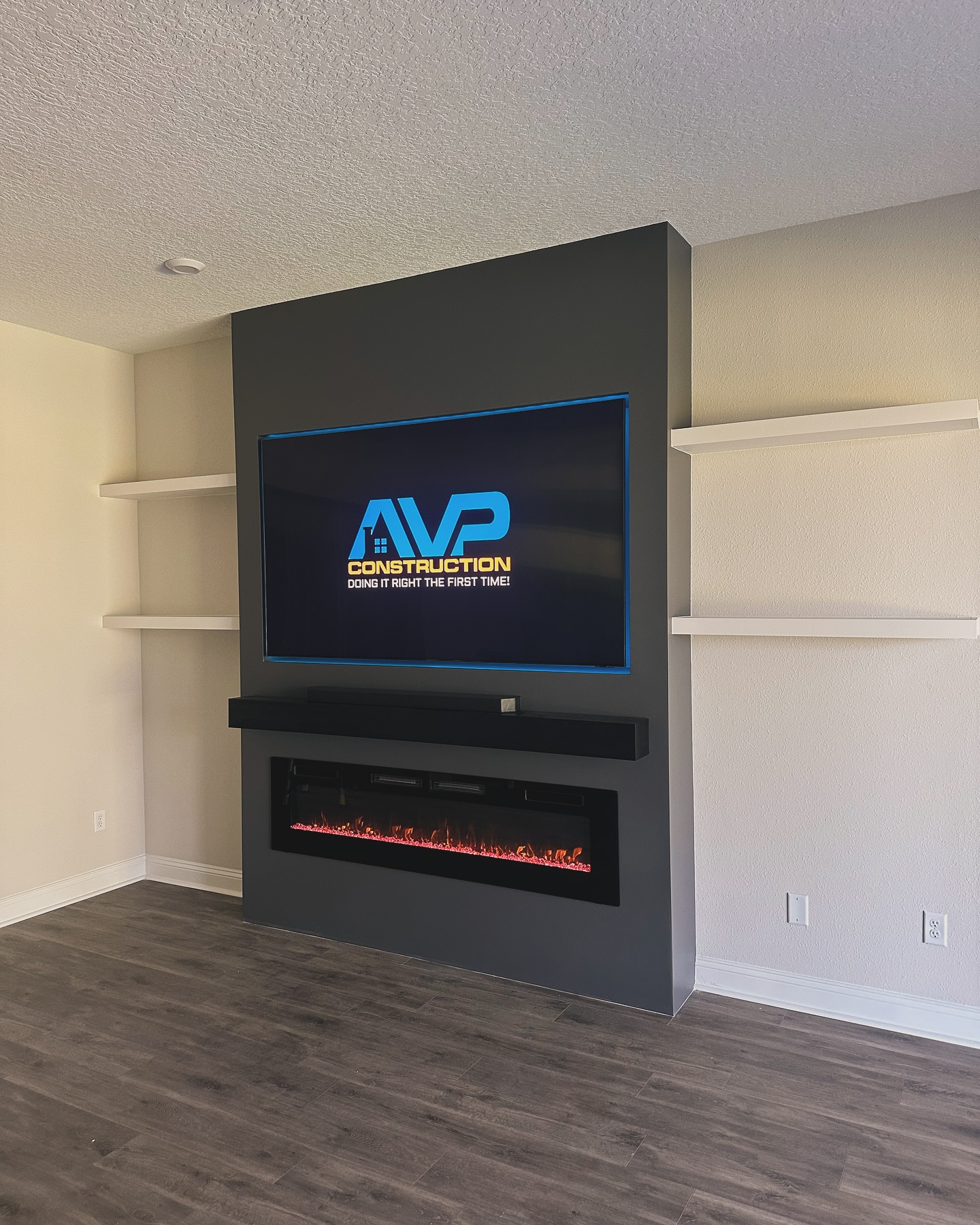 Custom living-room media wall with paneling by AVP Construction JAX — Jacksonville & St. John's County, FL