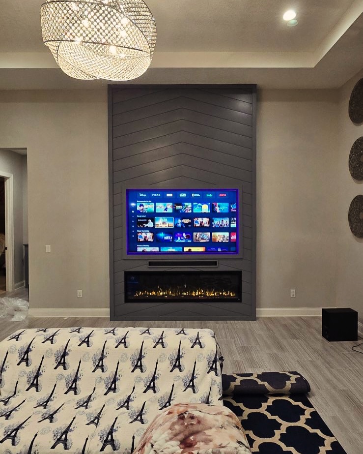 Floor-to-ceiling media wall with custom millwork by AVP Construction JAX — Jacksonville & St. John's County, FL
