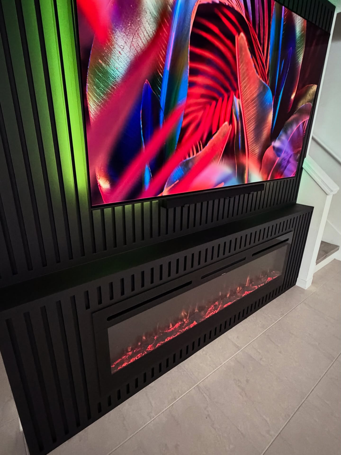 Wall-mounted TV with under-cabinet storage by AVP Construction JAX — Jacksonville & St. John's County, FL