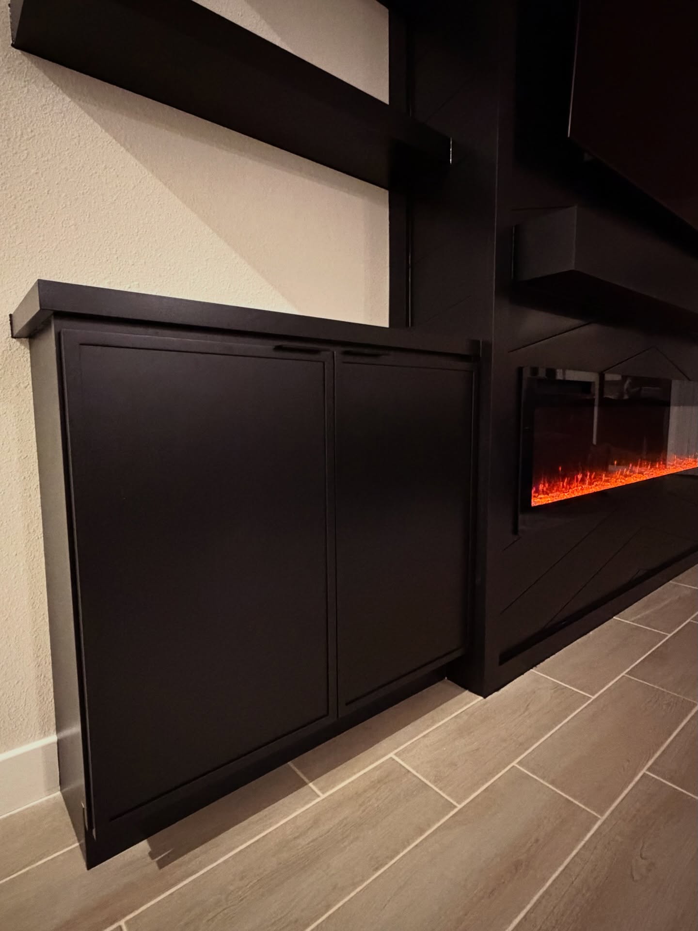 Built-in TV cabinet flanked by display shelving by AVP Construction JAX — Jacksonville & St. John's County, FL