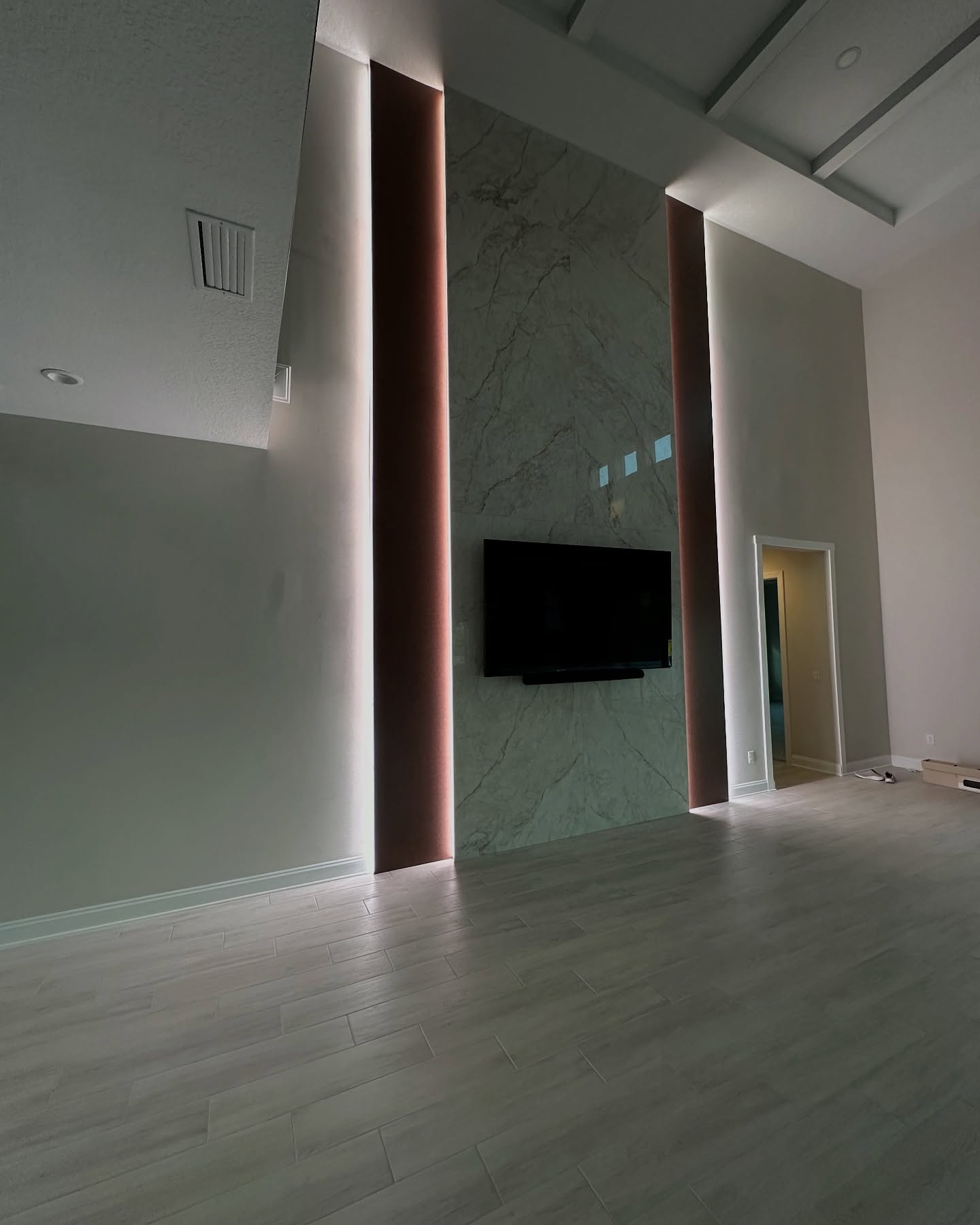Custom TV entertainment center built-in by AVP Construction JAX — Jacksonville & St. John's County, FL