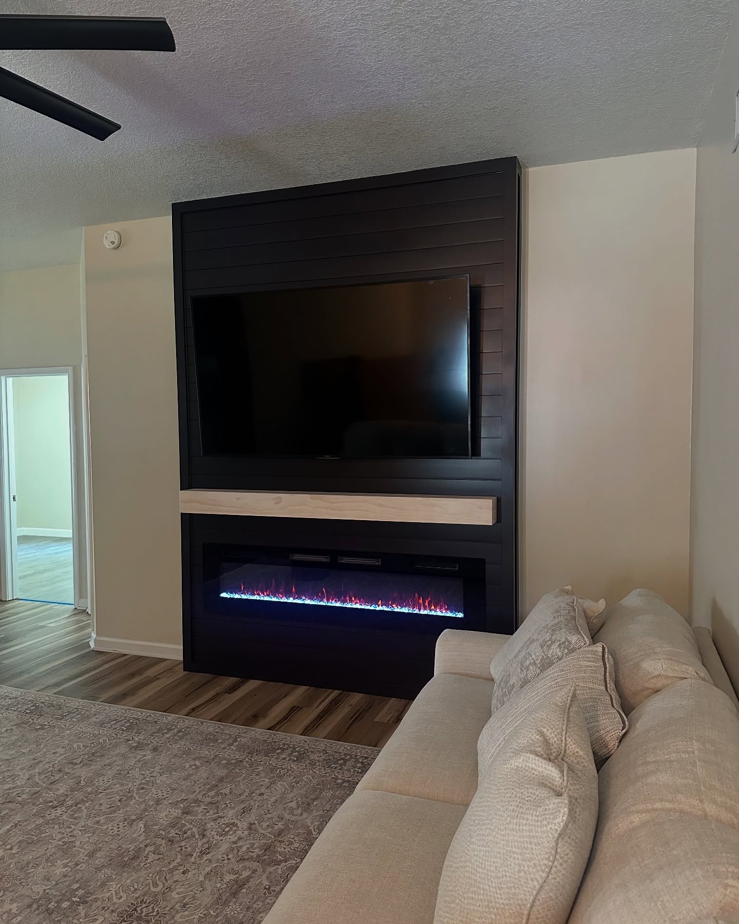 Floating-shelf TV built-in with shaker cabinets by AVP Construction JAX — Jacksonville & St. John's County, FL