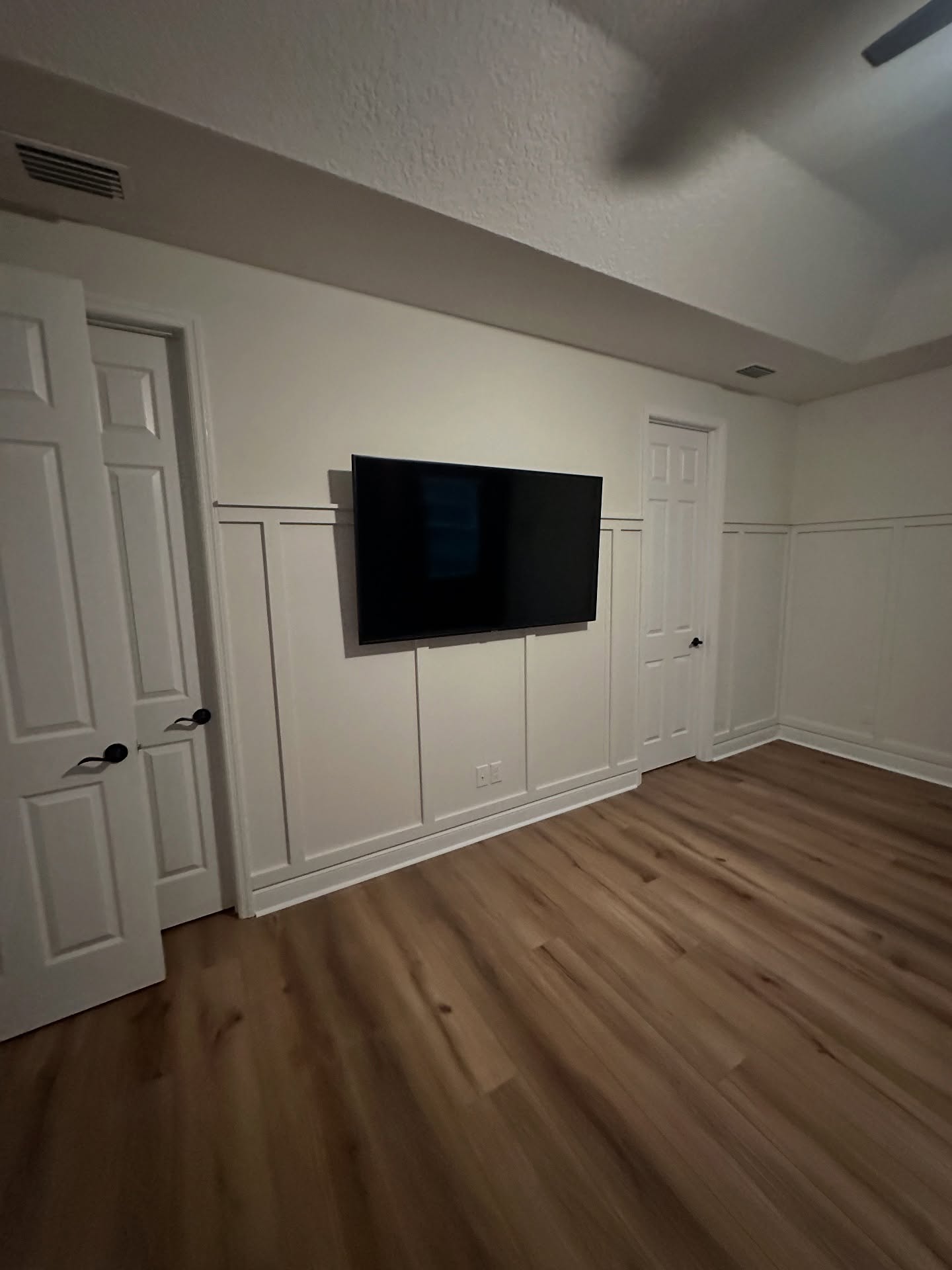 Slat-wall TV feature with hidden wiring by AVP Construction JAX — Jacksonville & St. John's County, FL