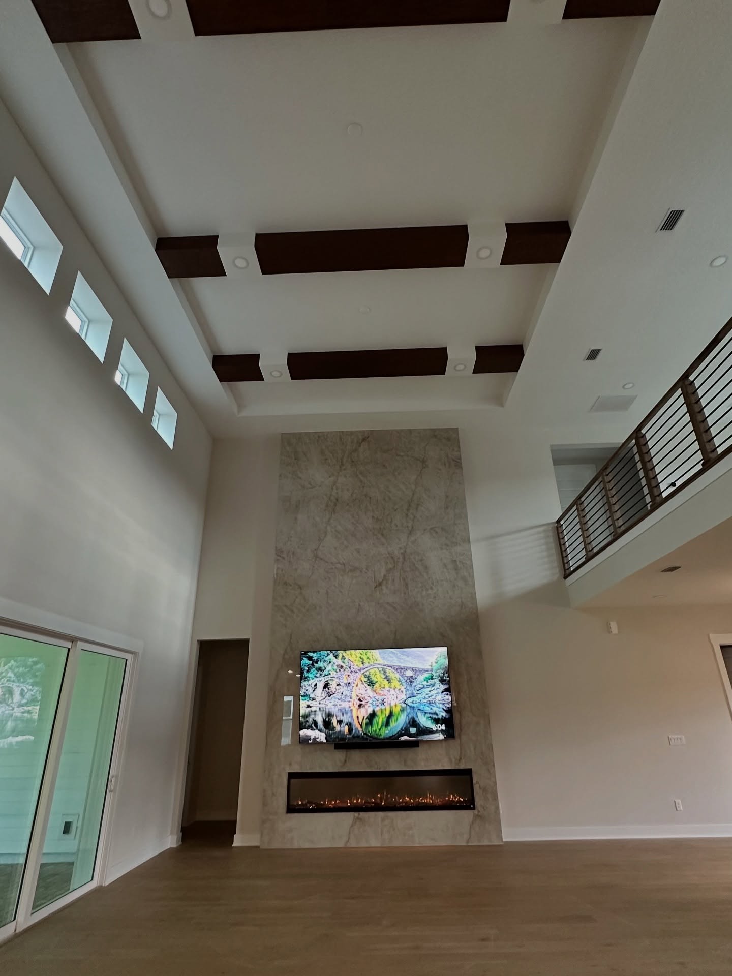 Wall-mounted TV with under-cabinet storage by AVP Construction JAX — Jacksonville & St. John's County, FL