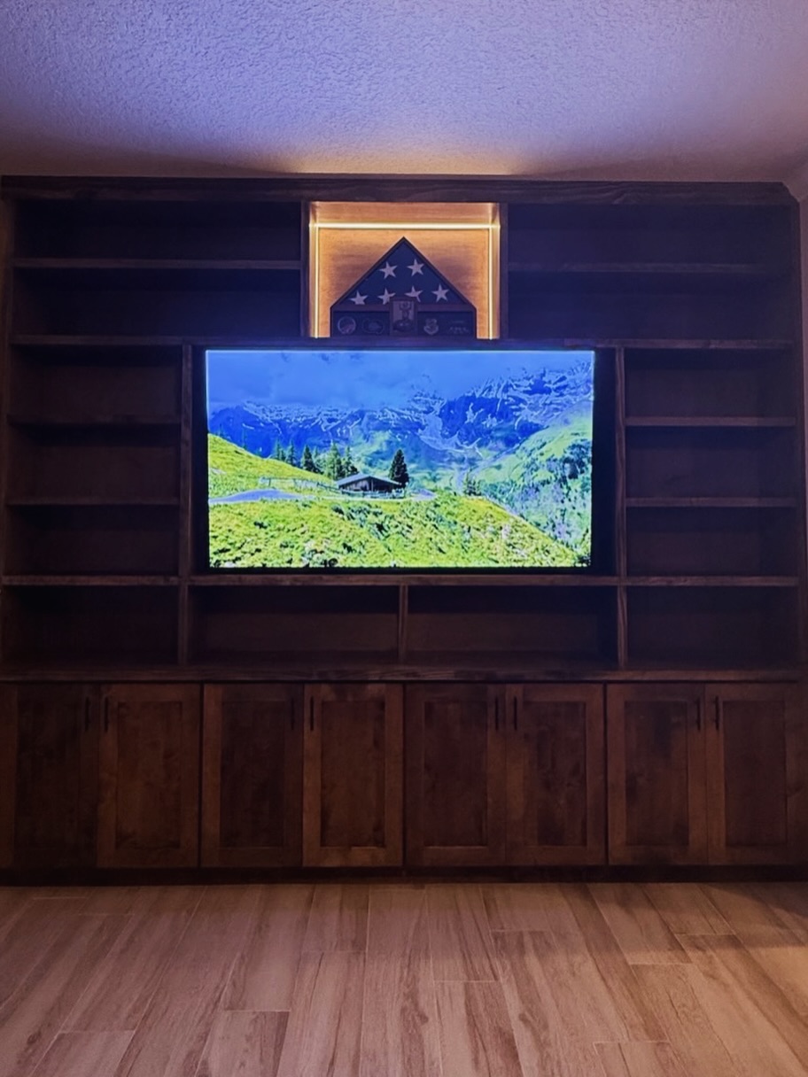 Custom TV entertainment center built-in by AVP Construction JAX — Jacksonville & St. John's County, FL