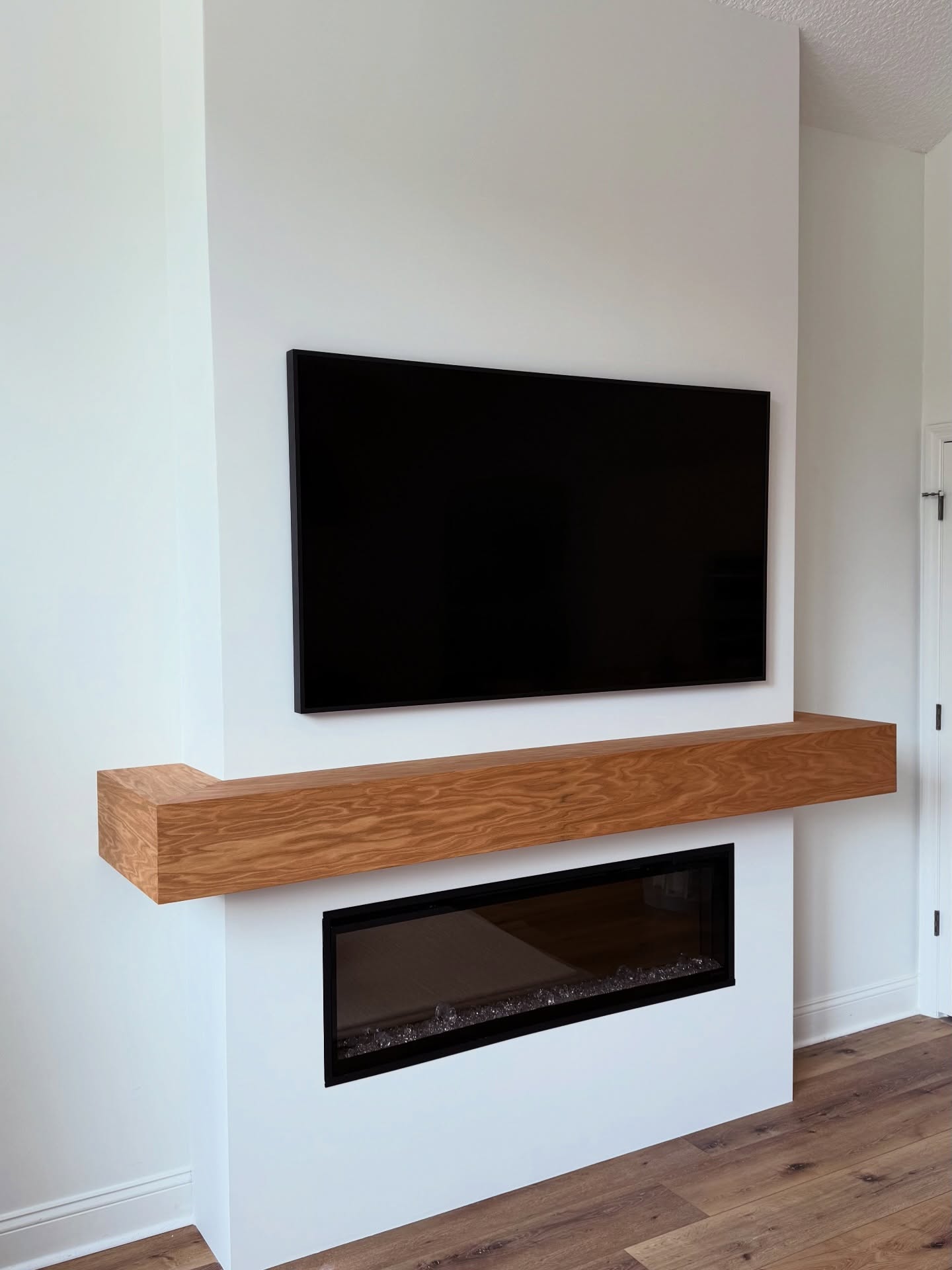 Floor-to-ceiling media wall with custom millwork by AVP Construction JAX — Jacksonville & St. John's County, FL